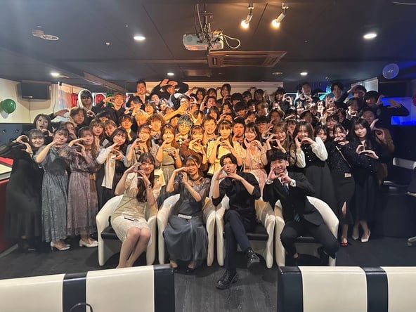 A large group posing together indoors